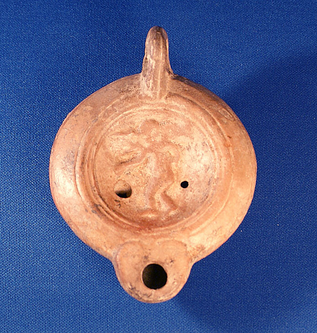 A Terracotta Oil Lamp - Cupid (Eros) c. 1-2nd Cent AD